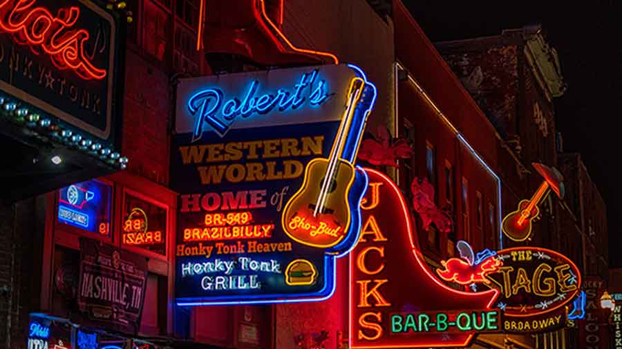 Honky Tonk signs lit up at night in Nashville.